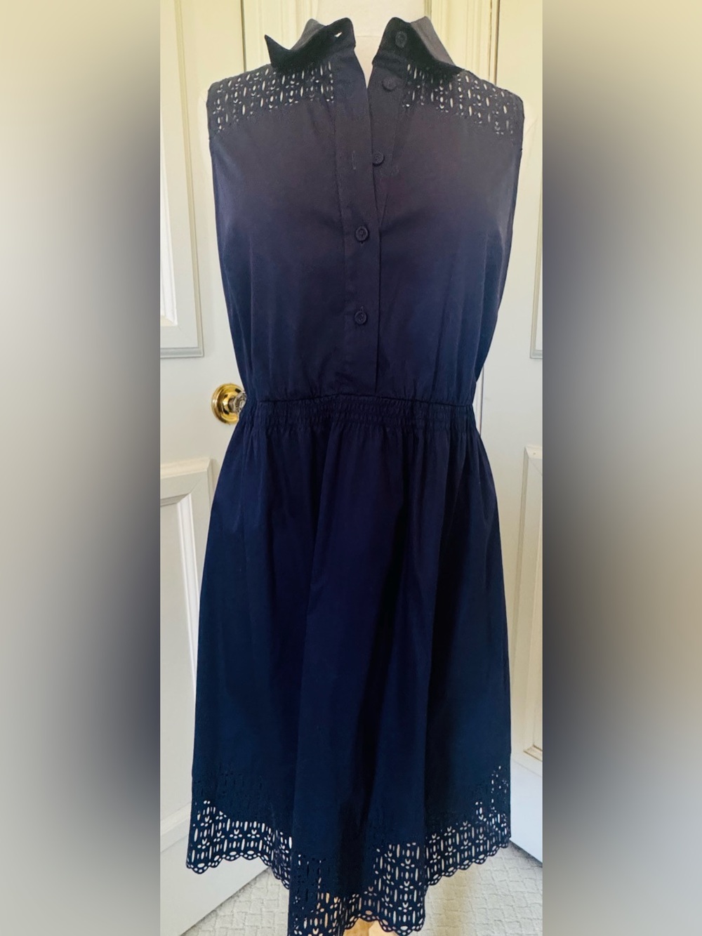 Blue dress with cut work at shoulders and hem